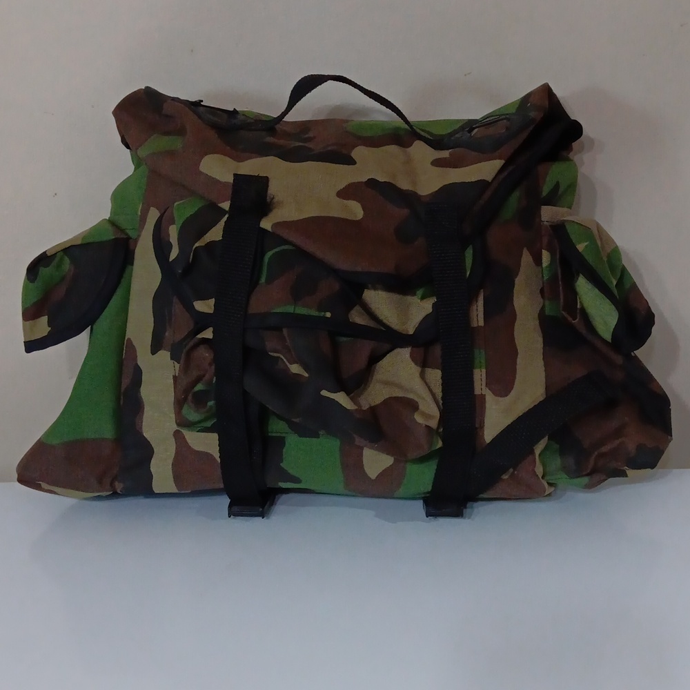 Redhead military grade vest with pockets and backpack and seat and a poncho